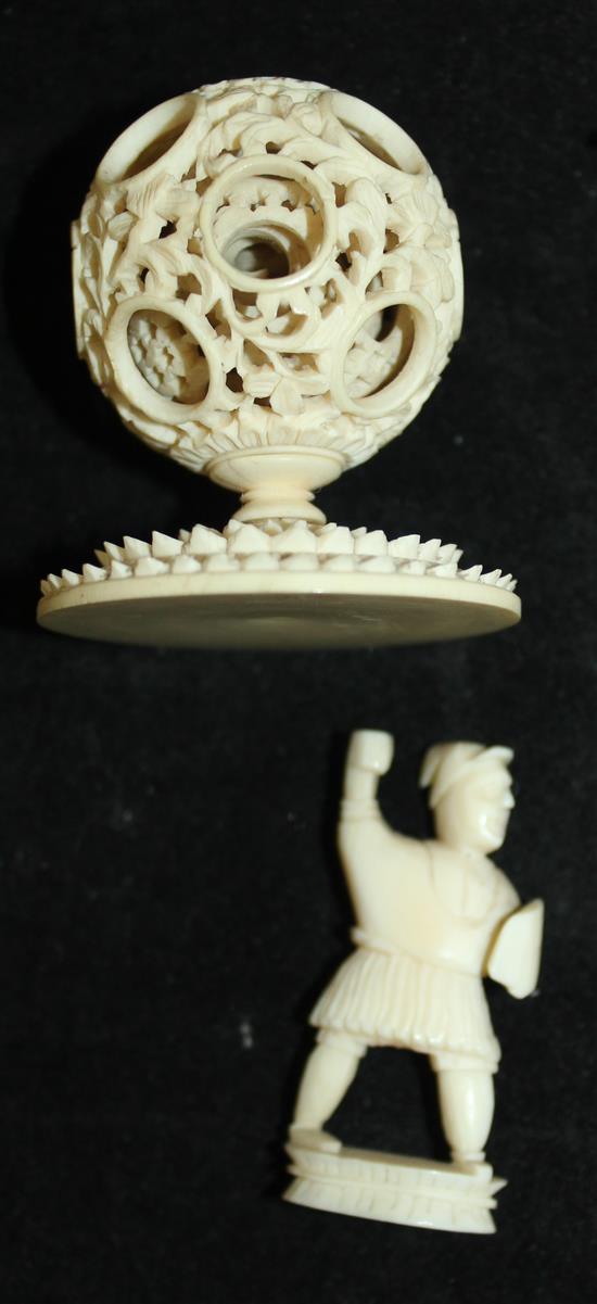 A Chinese export ivory puzzle ball and stand and four similar ivory chess pieces, 19th / early 20th century, 6.5cm - 21cm